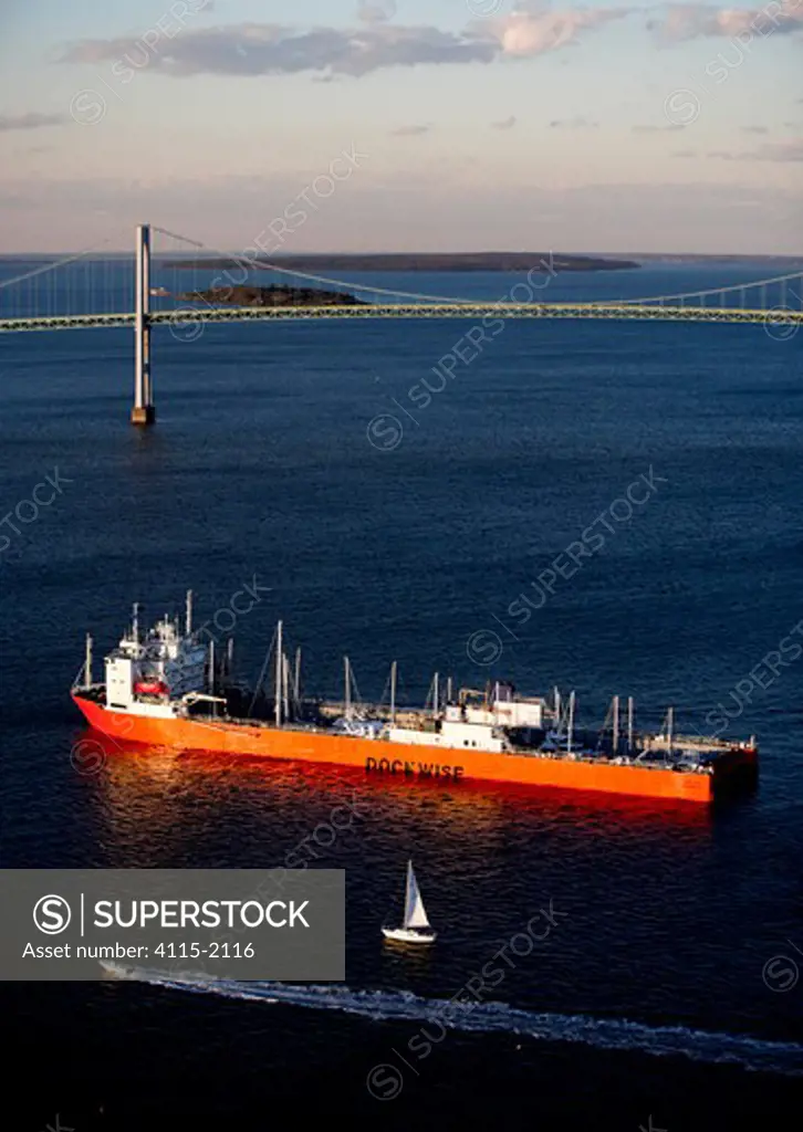 Dockwise yacht transport ship in front of Newport Bridge, Rhode Island, USA. Autumn 2006