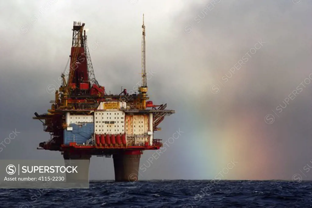 A rainbow forms behind the Statfjord Bravo production platform in the Norwegian section of the North Sea, September 2007
