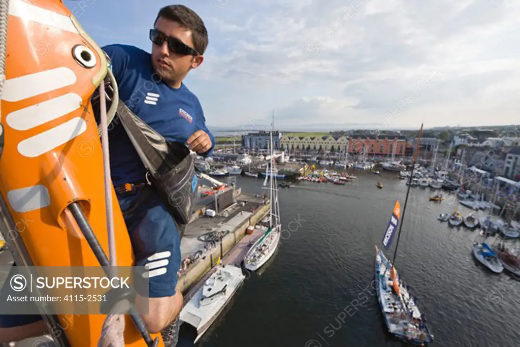 Rigger Lester Walker checking the rig on 'Ericsson 4' after the Volvo Ocean Race 2008-09 In-port race in Galway, Ireland. May 2009