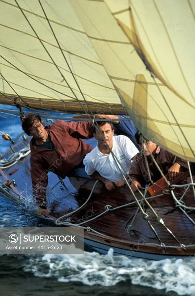 The crew of 8m classic yacht 'Esterel' watching for the mark during racing in La Nioulargue, St Tropez, France.