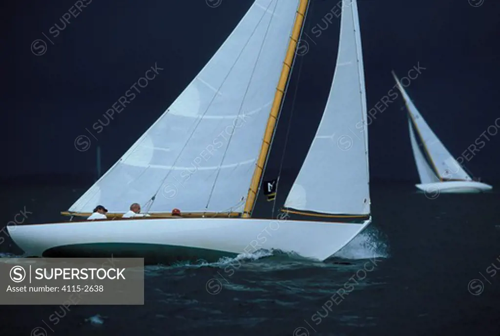 Classic yachts beating to windward in stormy weather during the Museum of Yachting's annual regatta in Newport, Rhode Island, USA.