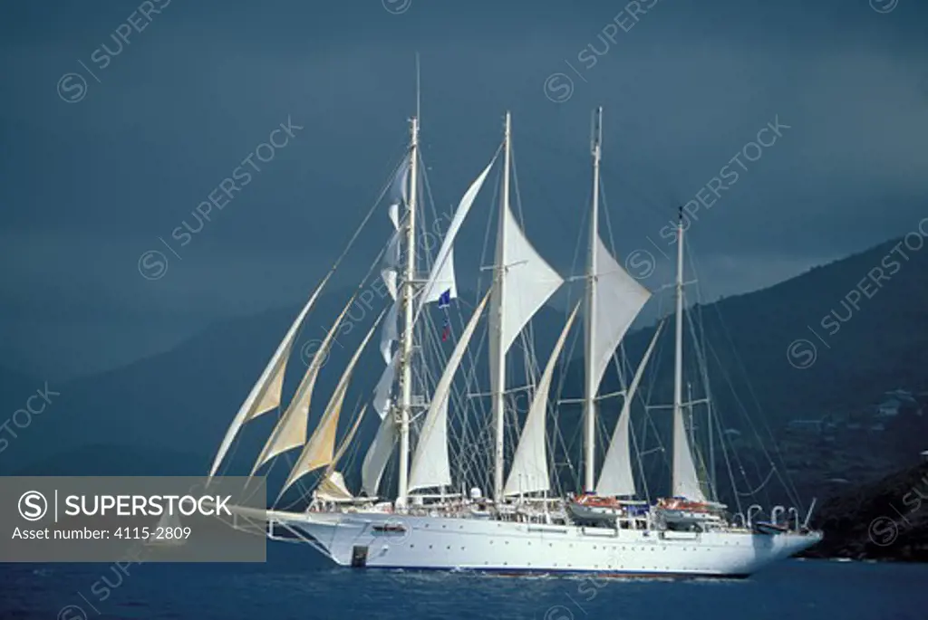 Clipper ship 'Flying Cloud' beneath stormy skies during Antigua Classics Week, Caribbean.