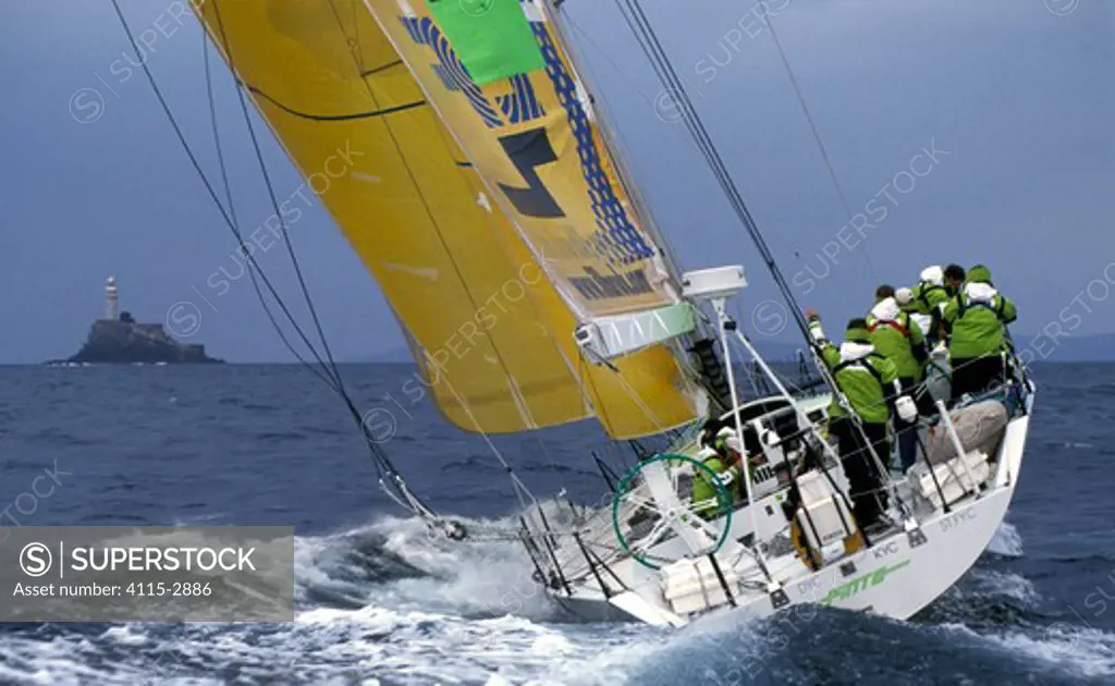 Volvo 60 'Illbruck' reaches the Fastnet Rock during the race, part of their training for the Volvo Ocean Race, 1999.