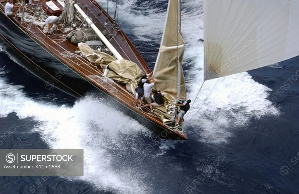 Foredeck crew aboard J-Class yacht 'Velsheda' lower the jib after the windward mark rounding, Antigua Classic Yacht Regatta, April 2003.