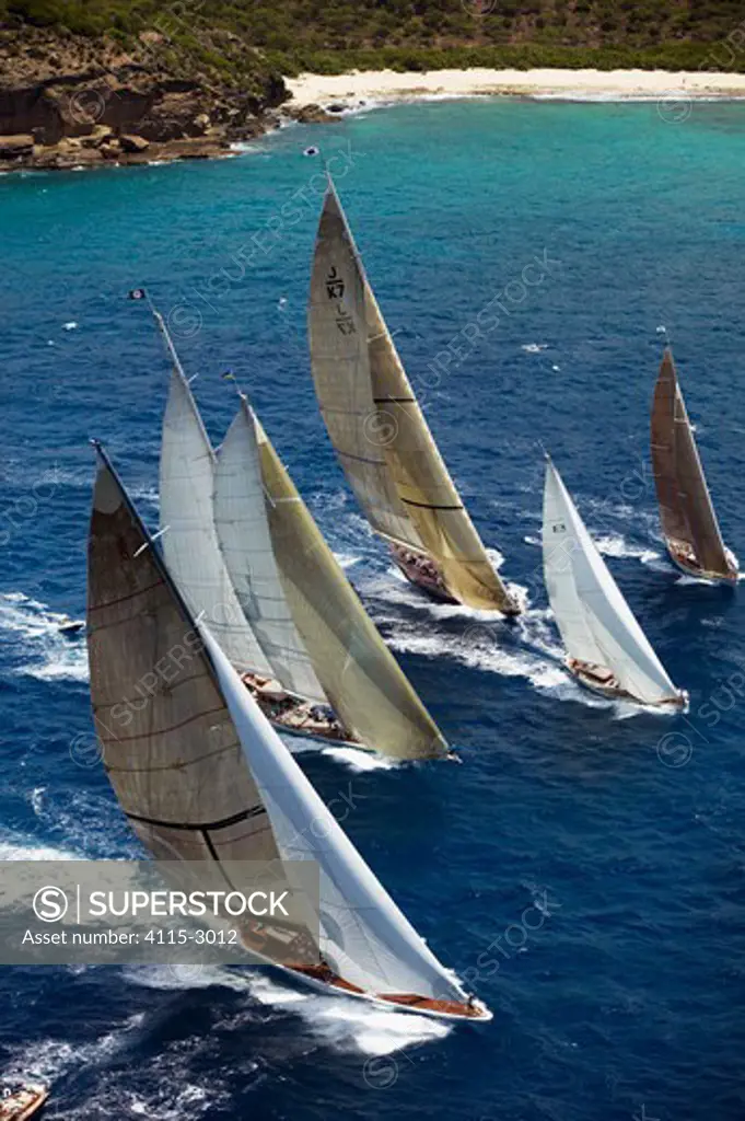 From left; 'Ranger', 'Windrose' and 'Velsheda' chase a couple of smaller boats at Antigua Classic Yacht Regatta, Caribbean 2004. Ranger and Velsheda are Property Released.