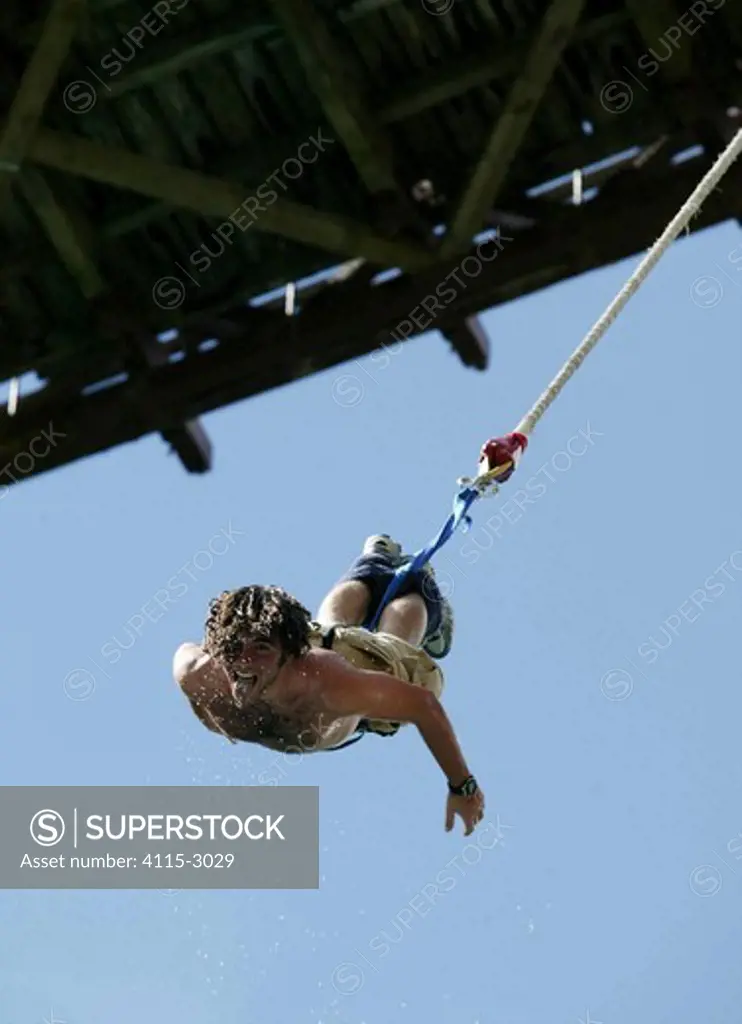 Bungy jumping from the Kawarau Bridge, a 43 metre bungy jump above the Kawarau River, Queenstown, New Zealand.