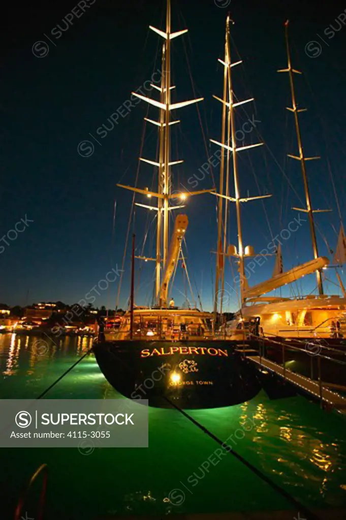The 174ft superyacht 'Salperton' lit up at night in Gustavia during the St Barts Bucket, Caribbean.