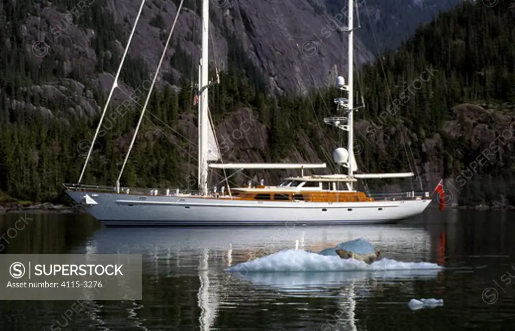 118ft S&S designed superyacht, 'Timoneer', passes by a seal on an iceberg in Fords Terror, Tongass National Forest, south-east Alaska.