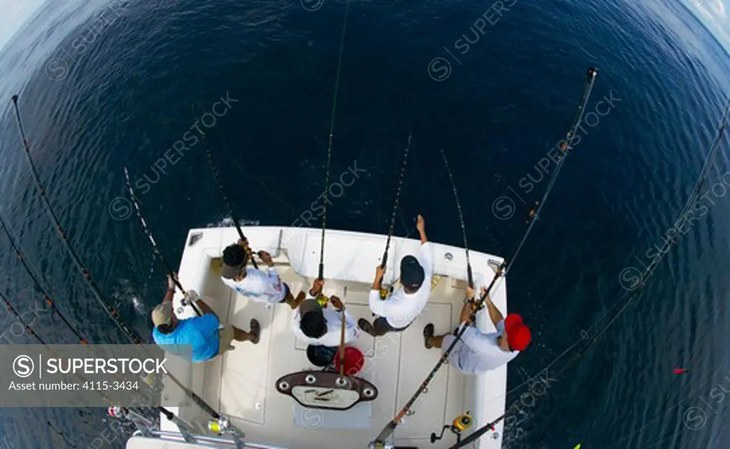 Deep sea fishing off the stern of a sport fishing boat, Guatemala.