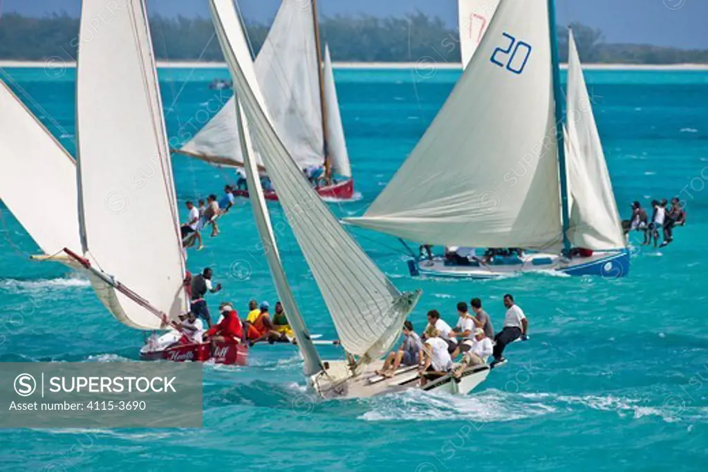 Fleet of boats racing in the Bahamian Sloop regatta, Georgetown, Exumas, Bahamas. April 2009.