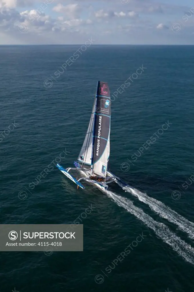 Maxi trimaran 'Banque Populaire V' at beginning of Jules Verne Trophy attempt. Brest, Brittany, France, January 2011. All non-editorial uses must be cleared individually.