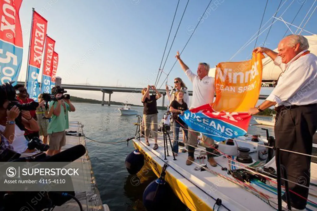 Skipper Brad Van Liew celebrating on board 'Le Pingouin' after finishing first in sprint four of the Velux 5 Oceans race. Charleston, South Carolina, USA, April 2011. All non-editorial uses must be cleared individually.