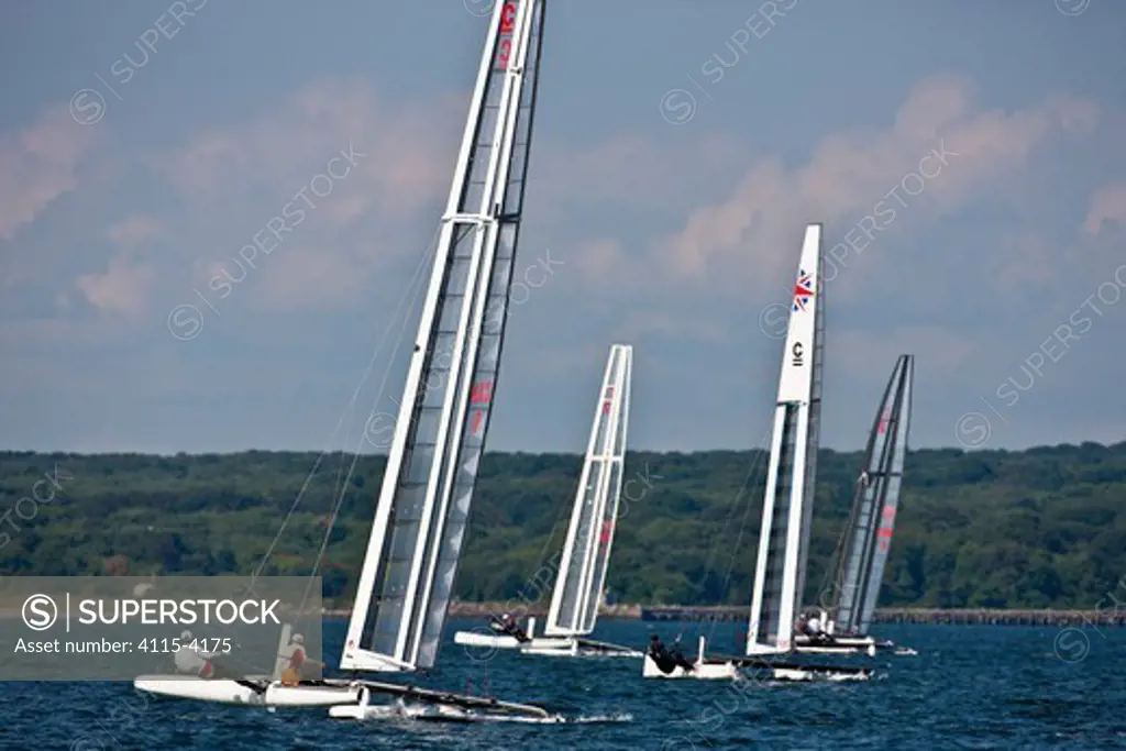 C-Class catamaran fleet during training for Little America's Cup. Newport, Rhode Island, USA, August 2010. All non-editorial uses must be cleared individually.