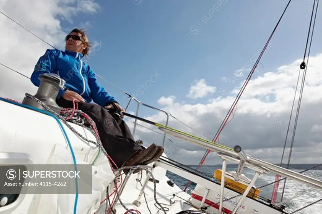 Skipper Michel Bothuon helming on board 'Les Recycleurs Bretons' ahead of La Solitaire du Figaro 2011. Brest, France, May 2011. All non-editorial uses must be cleared individually.