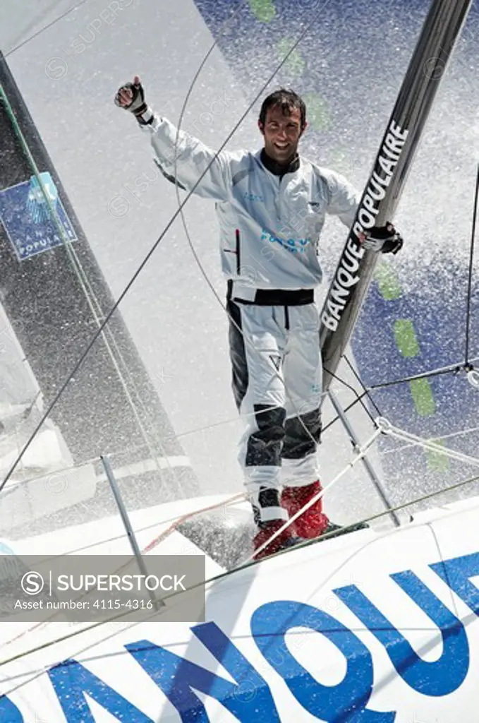 Skipper Armel Le Cleac'h soaked on board monohull 'Banque Populaire' during training ahead of Transat Jacques Vabre 2011. Lorient, Brittany, France, July 2011. All non-editorial uses must be cleared individually.