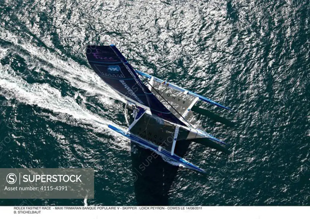 Maxi-trimaran 'Banque Populaire V' skippered by Loick Peyron during the RORC Rolex Fastnet Race. Isle of Wight, England, August 2011. All non-editorial uses must be cleared individually.