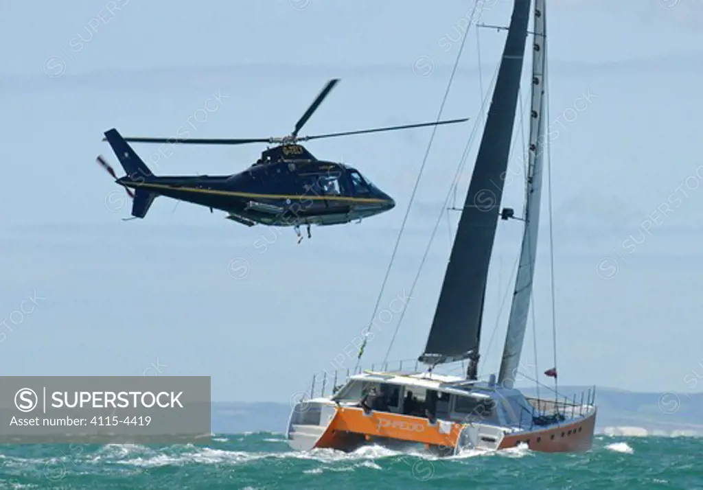 Gunboat 66 'Phaedo' pursued by helicopter off The Needles to the west of the Isle of Wight during RORC Rolex Fastnet Race, England, August 2011. All non-editorial uses must be cleared individually.