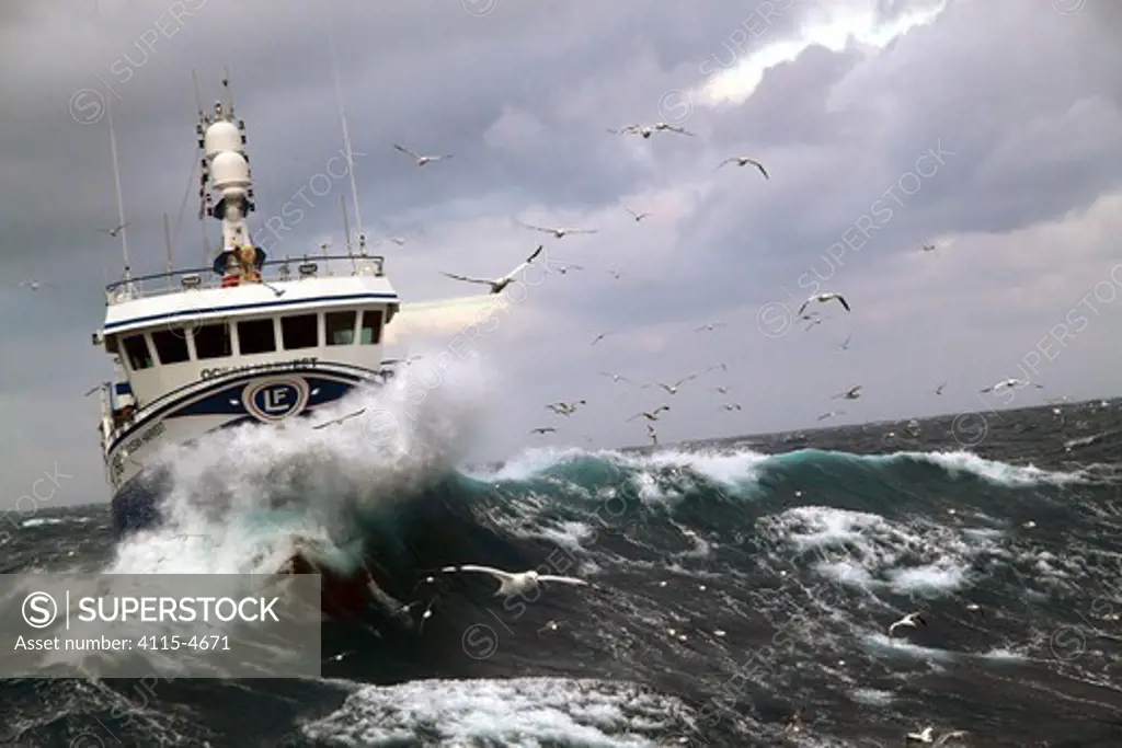 Wave breaking over the bow of fishing vessel 'Ocean Harvest' on the North Sea, January 2010.