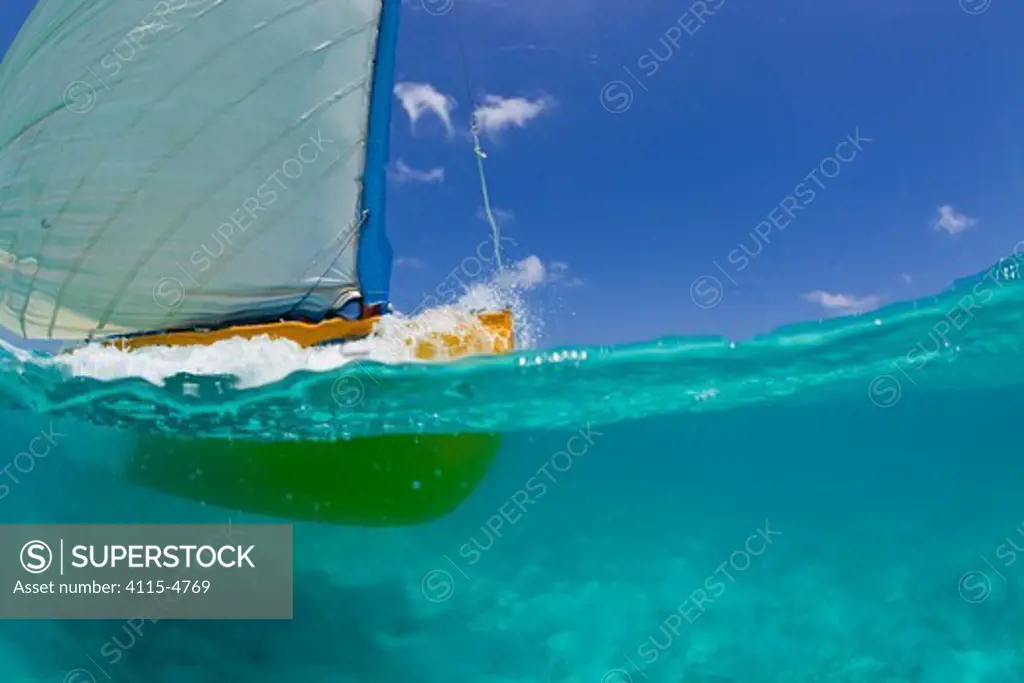 Yellow sailing-boat during the Bahamian Sloop regatta, Georgetown, Exumas, Bahamas. April 2009.