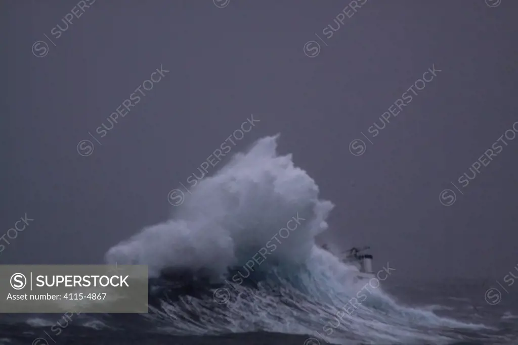 Huge wave hitting fishing vessel 'Harvester' while operating in the North Sea. Europe, November 2010. Property released.