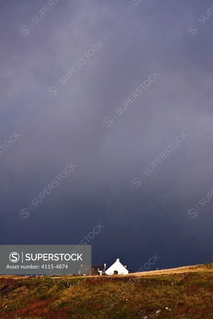 Lone house beneath stormy skies. Elgol, Isle of Skye, Scotland. September 2010.
