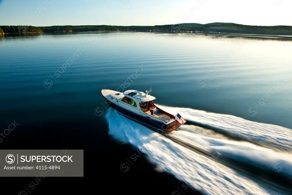 Hinckley T38 speedboat planing off Rhode Island, USA, August 2008. Model and property released.