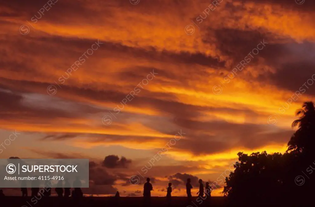 Local people at sunset on Biak Island, Western Papua, Indonesia, August 2002