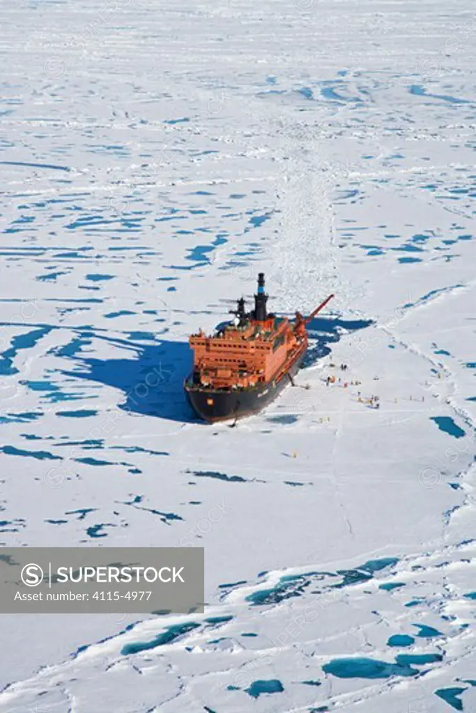 Aerial view of Russian nuclear icebreaker, ""NS 50 Lyet Pobyedi"" (50 Years of Victory) with tourists on ice, at the North Pole, July 2008