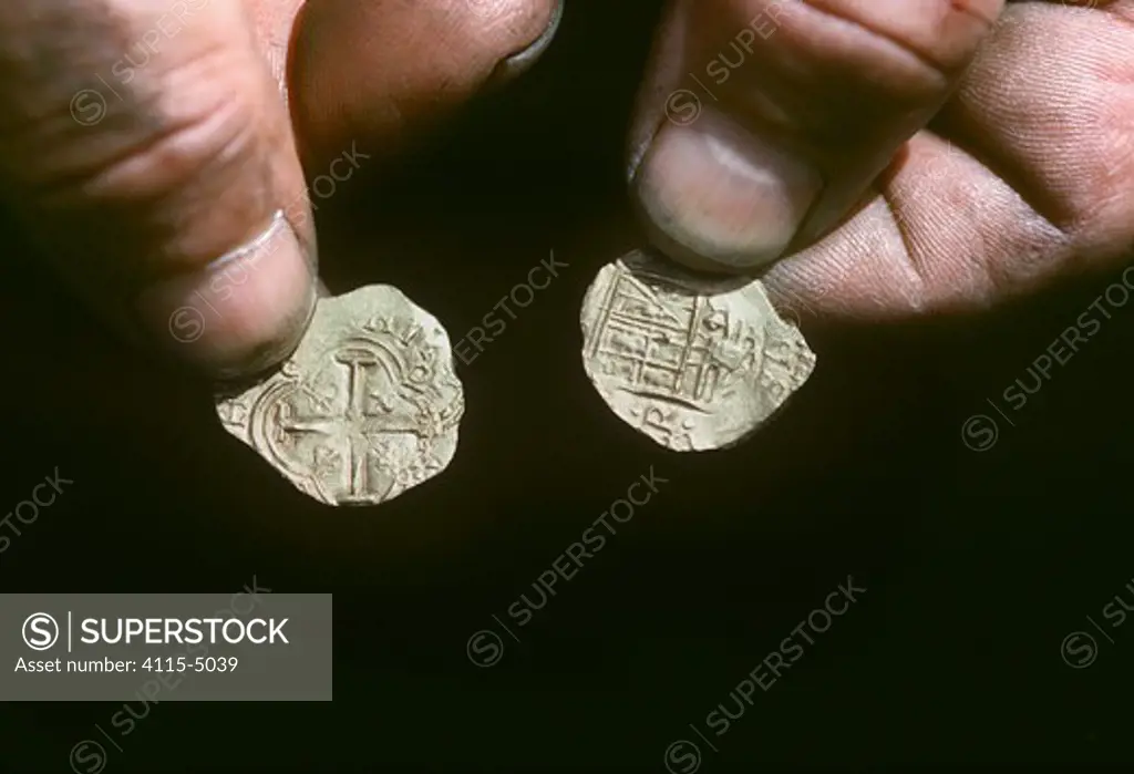 Gold coins recovered from the shipwreck ""Las Maravillas"", a Spanish galleon sunk in 1658, Bahamas. 1987. model released