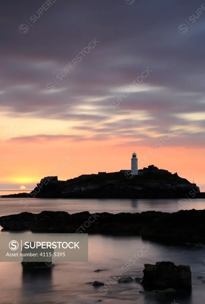 Godrevy Lighthouse at sunset, nr Hayle, Cornwall, UK. June 2009.