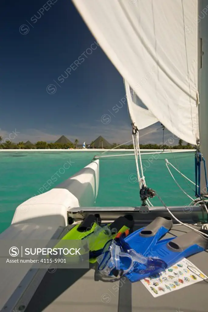 Water sports activities, sailboarding and catamaran sailing at the Handhufushi Resort in Addu Atoll, Maldives. May 2008. Property released.
