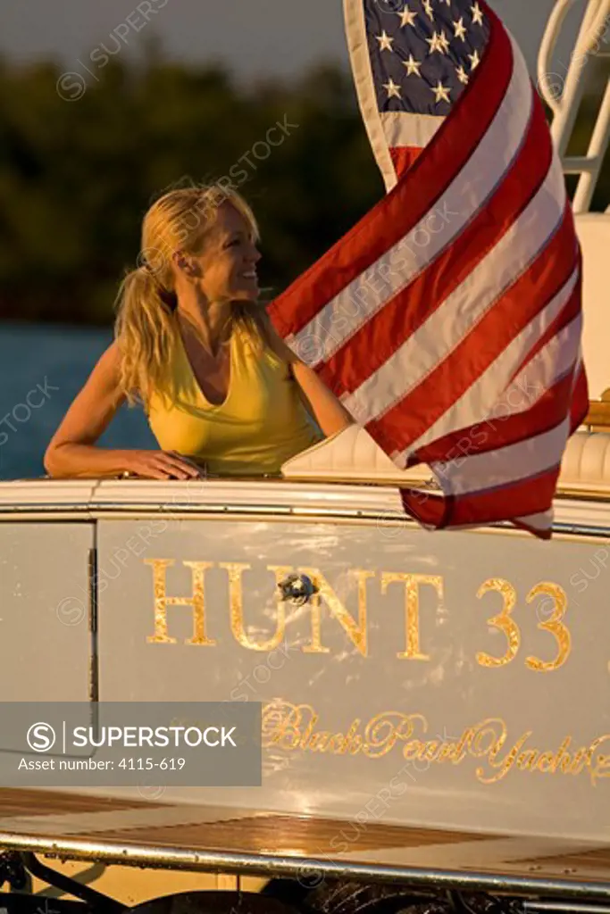 Woman aboard Surf Hunter 33 Jet boat off Marco Island, Florida.