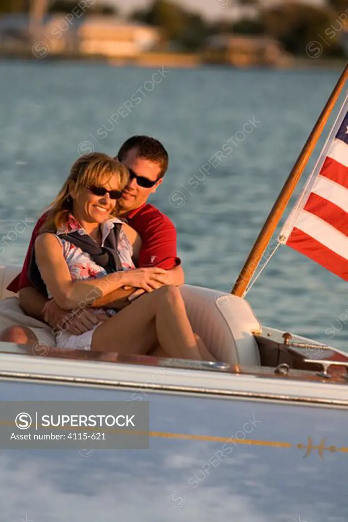 Couple aboard Surf Hunter 33 Jet boat off Marco Island, Florida.