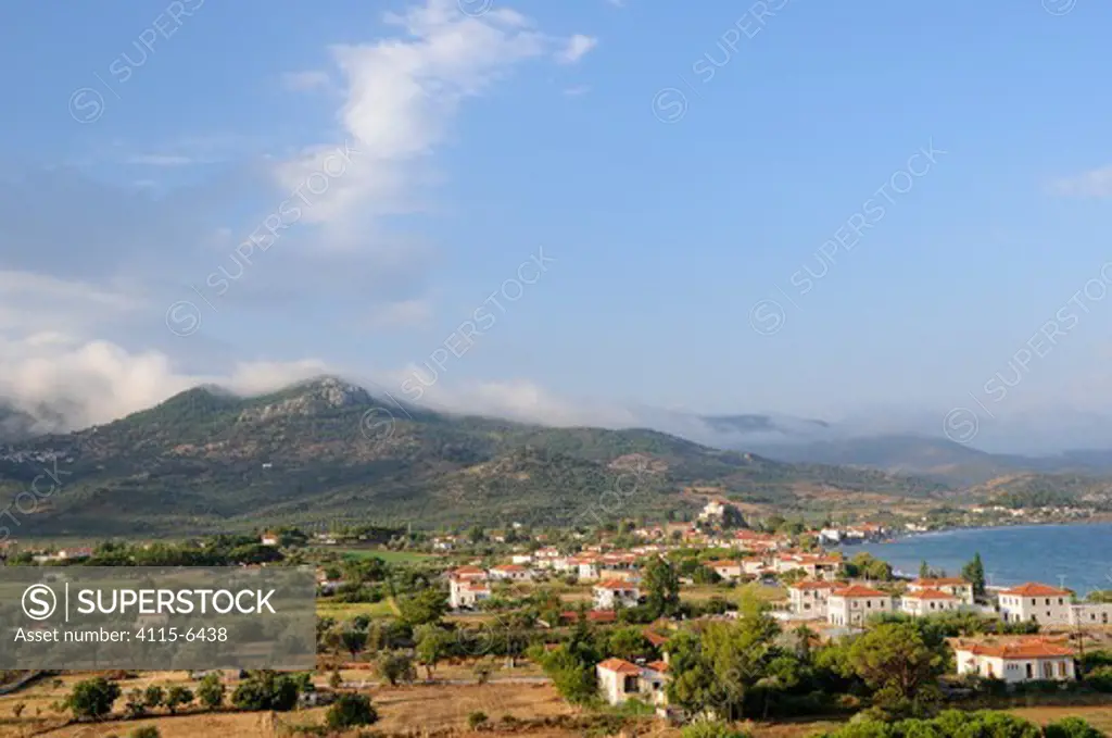 Overview of Petra village, with mist rising from mountains in the background after rain. Lesbos / Lesvos, Greece, August 2010