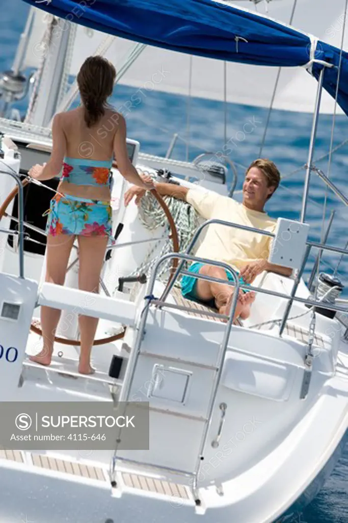 Couple cruising onboard a Sunsail Oceanis 423, British Virgin Islands
