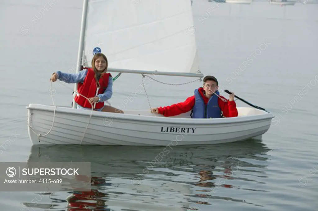 Children sailing dinghy 'Liberty'.