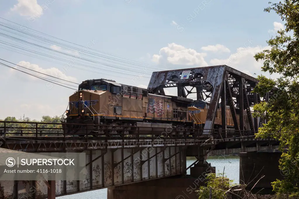 USA, Arkansas, North Little Rock, Train on train trestle, crossing Arkansas River