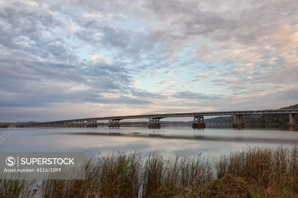 Bridge across a river at dusk, I-430 Bridge, Arkansas River, Little Rock, Pulaski County, Arkansas, USA