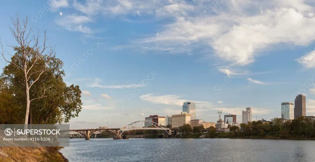 Bridge with city skyline at the waterfront, Arkansas River, Little Rock, Pulaski County, Arkansas, USA