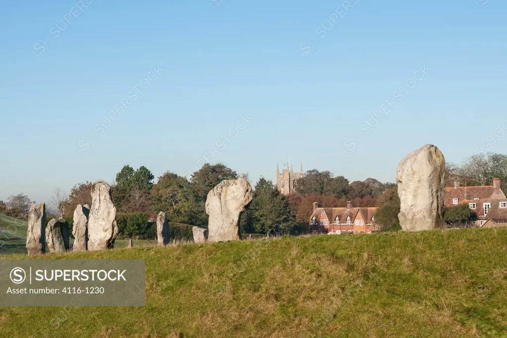 UK, Wiltshire, Avebury, View of Avebury stones and St James Church