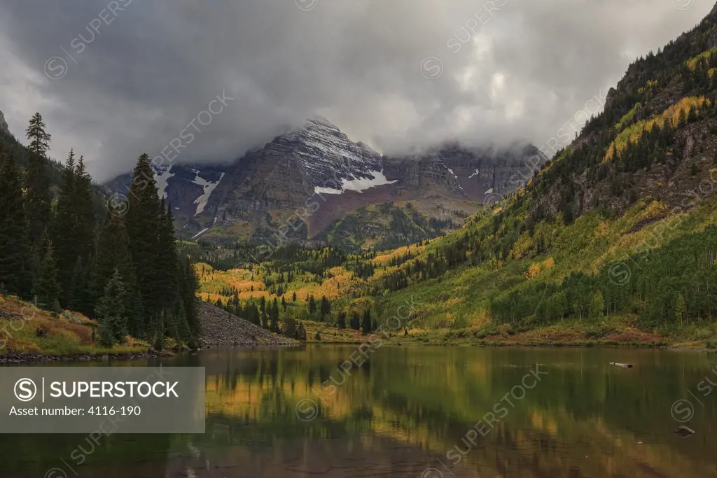 Clouds over a lake with mountains in the background, Maroon Lake, Maroon Bells, Colorado, USA