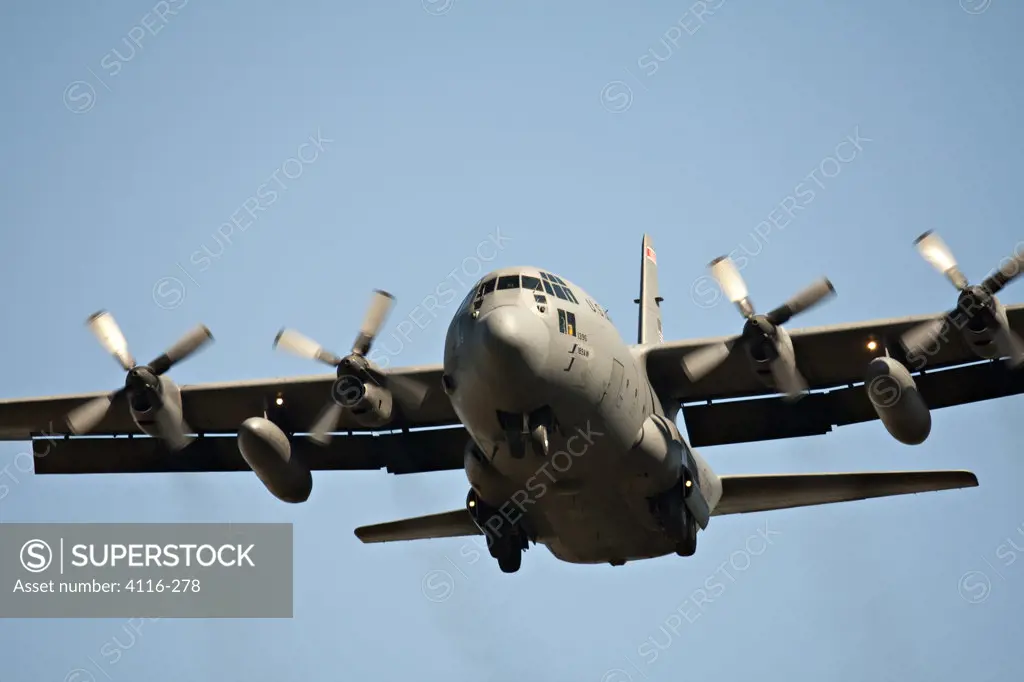 USA, Arkansas, Little Rock Air Force Base, Lockheed C-130 Hercules flying against blue sky