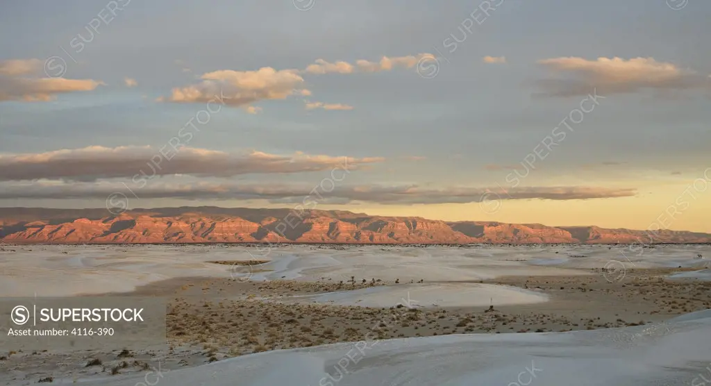 Gypsum sand dunes in a desert with mountains, Sacramento Mountains, White Sands National Monument, New Mexico, USA