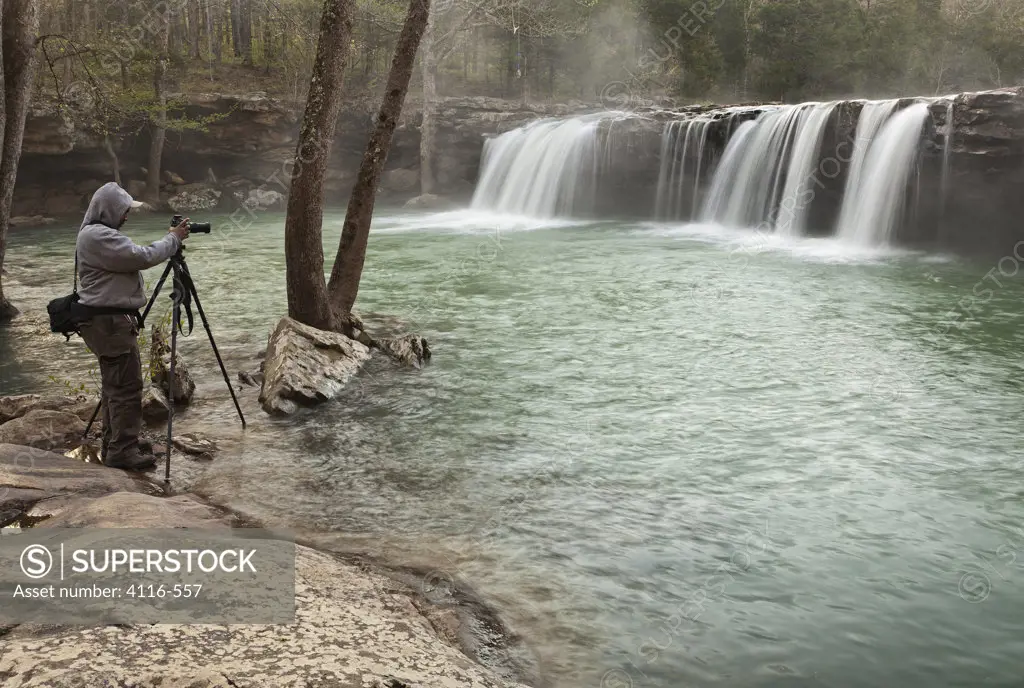 Photographer taking a picture of a waterfall, Falling Water Falls, Falling Water Creek, Arkansas, USA