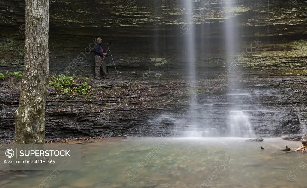 Photographer near a waterfall, Cornelius Falls, Arkansas, USA