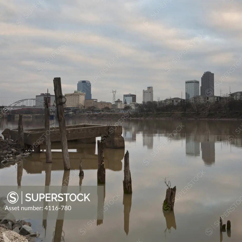 Ruins of a pier with city in the background, Little Rock, Arkansas River, Arkansas, USA