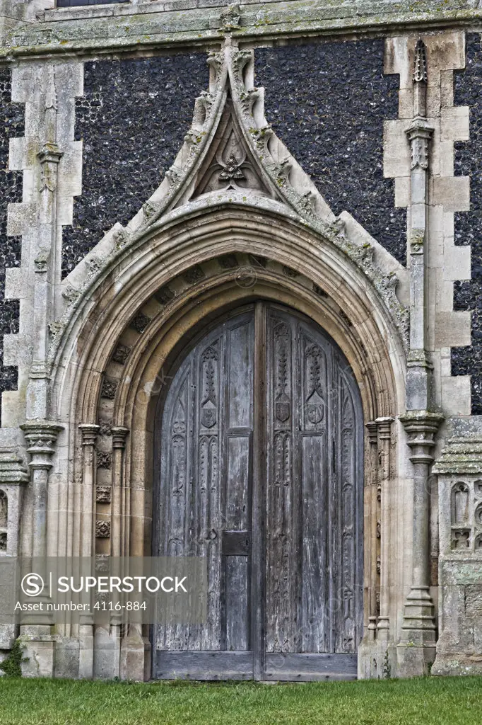 Arched doorway of The Church of St. Peter and St. Paul, Lavenham, Suffolk, England