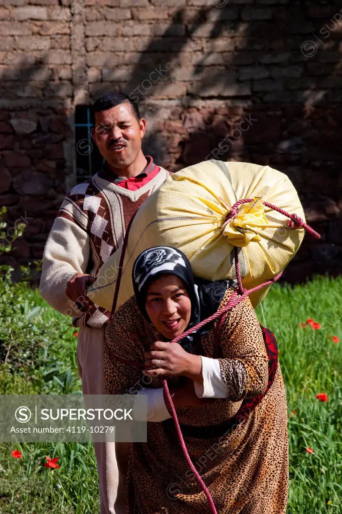 Photograph of a Moroccan man and woman working in the fields of Setti Fatma in the Ourika Valley, Morroco