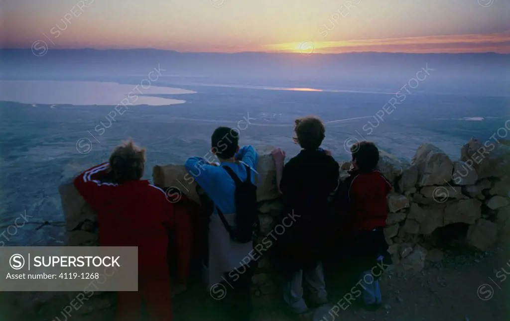 Four children on top of Masada at sunrise