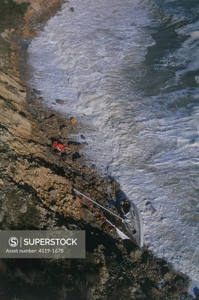 Photograph of a crashed sailboat on the cliffs of Normandy